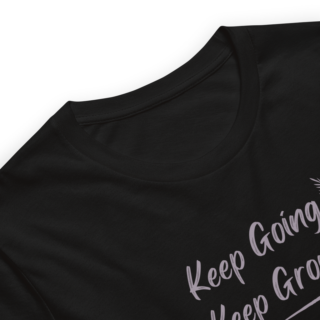 Close up of Keep Going Keep Growing text print on Velmora premium cotton motivational streetwear t-shirt